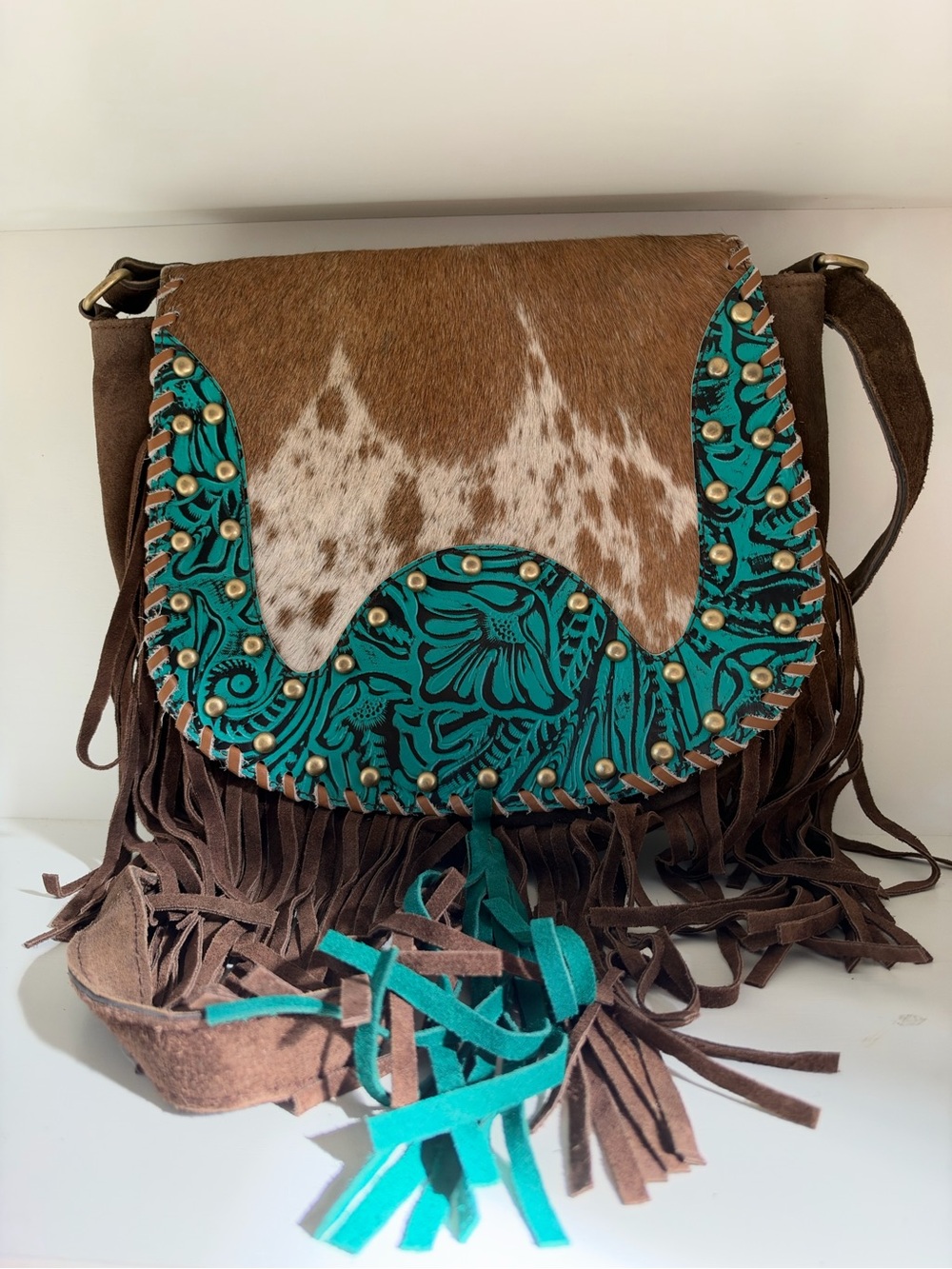 boho fringe crossbody bag with turquoise floral accent